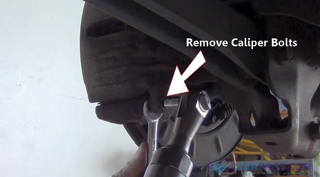 remove caliper mounting bolts