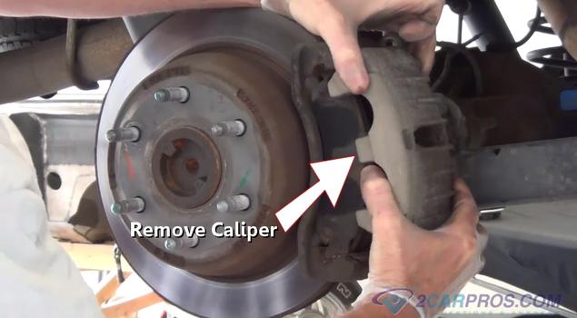 remove rear brake caliper