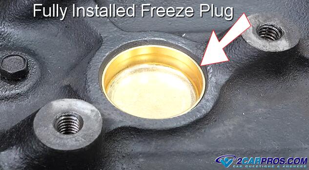 fully installed automotive engine block freeze plug