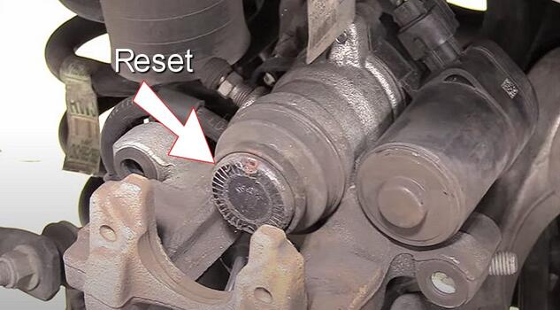 how to reset an automotive rear brake caliper parking brake actuator