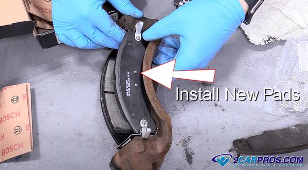 install new automotive front brake pads