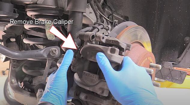 lift brake caliper from brake rotor