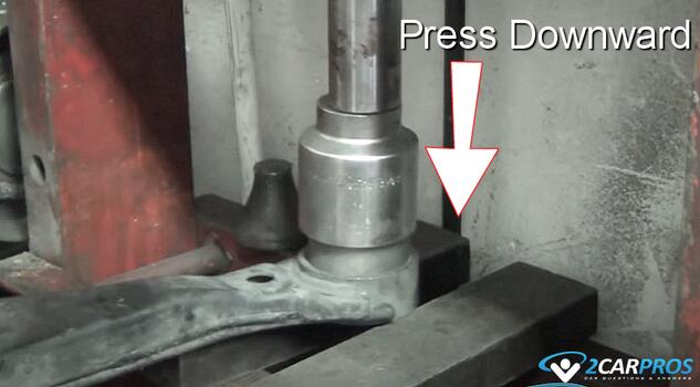 press in new control arm bushing