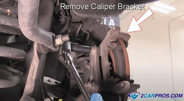 remove brake caliper bracket